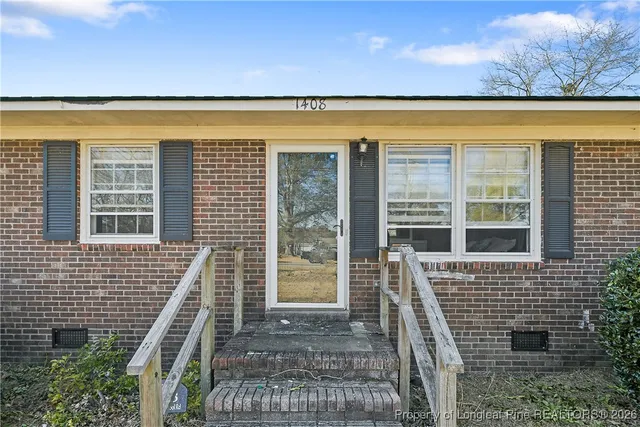 a view of front door and wooden floor