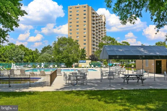 a view of a chairs and table in backyard