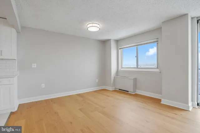 a view of an empty room with a window
