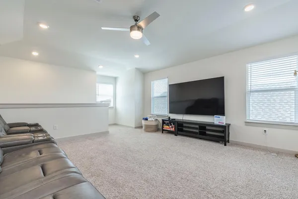 a bathroom with a sink a toilet and shower curtain