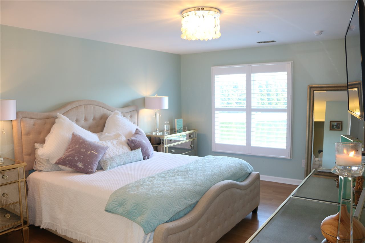 520 Springfork Drive, Unit 520 Cary, NC 27513 - Photo 19 of 25 MASTER BEDROOM OVERLOOKING LAKE