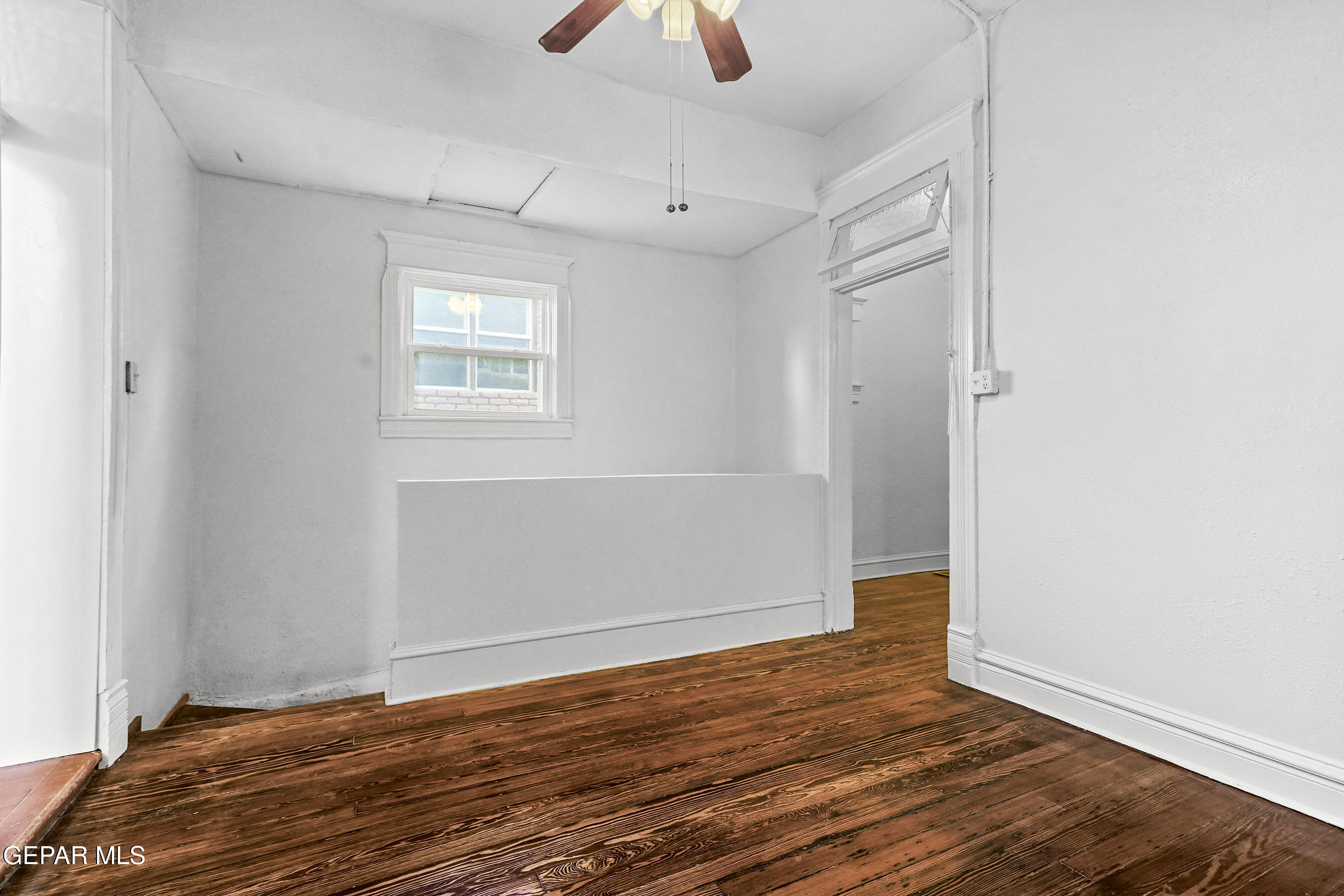 215 West Rio Grande Avenue El Paso, TX 79902 - Photo 22 of 62 an empty room with wooden floor and windows