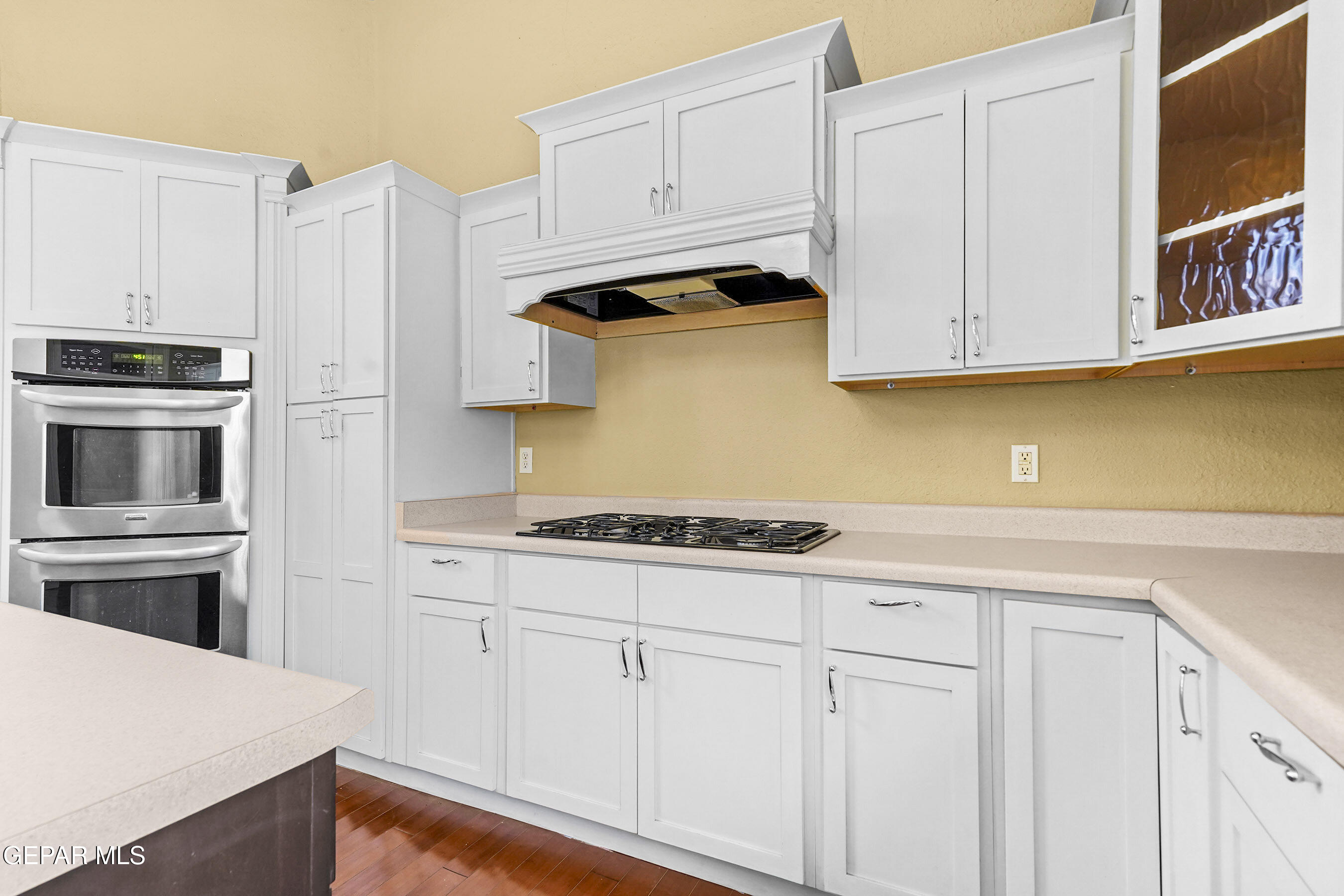 215 West Rio Grande Avenue El Paso, TX 79902 - Photo 28 of 62 a kitchen with granite countertop white cabinets and stainless steel appliances