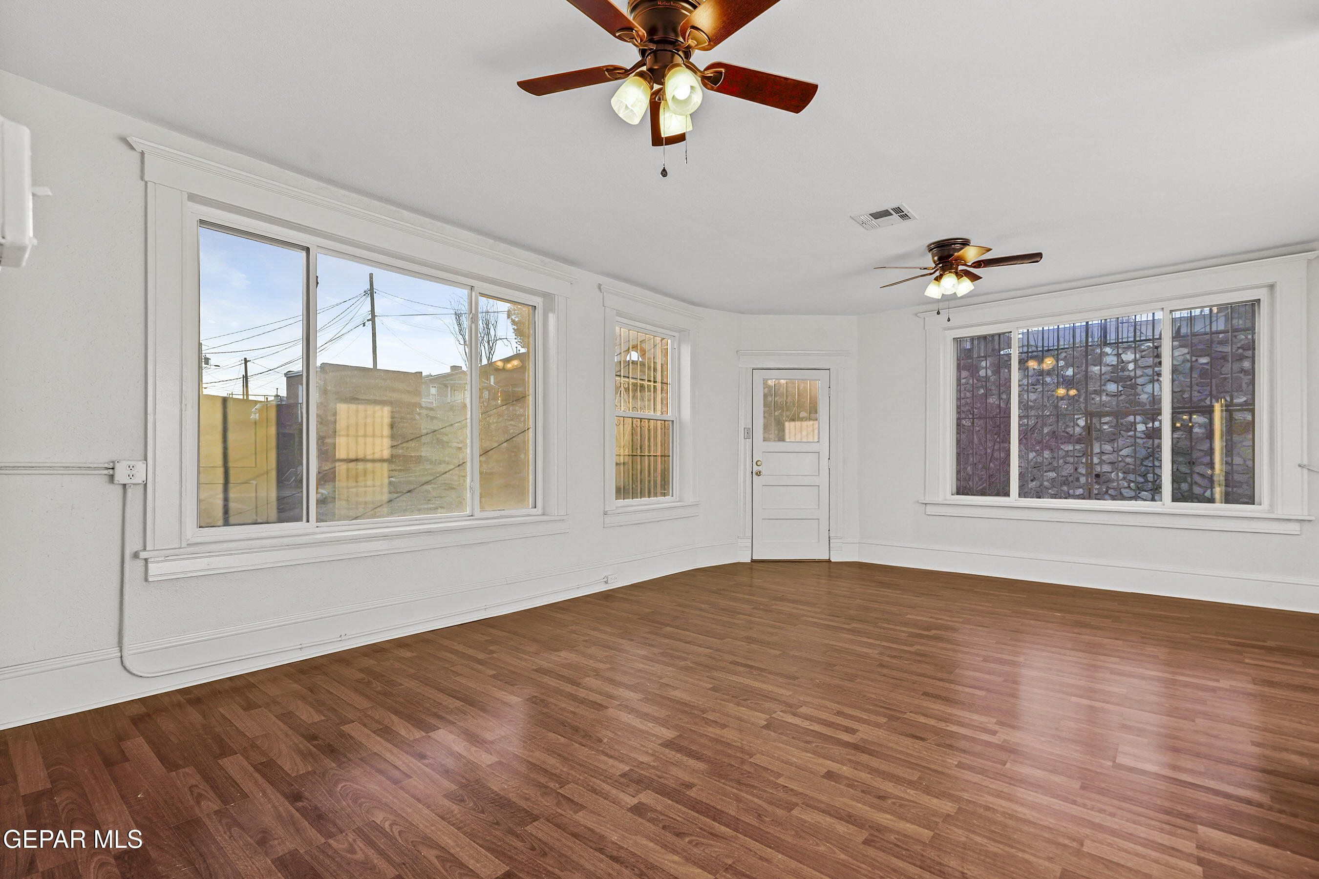 215 West Rio Grande Avenue El Paso, TX 79902 - Photo 34 of 62 a view of an empty room with window and wooden floor