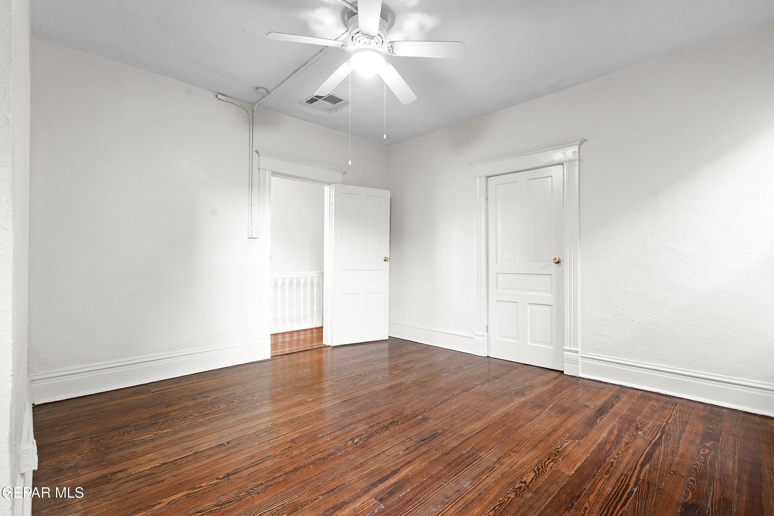 215 West Rio Grande Avenue El Paso, TX 79902 - Photo 42 of 62 an empty room with wooden floor and windows