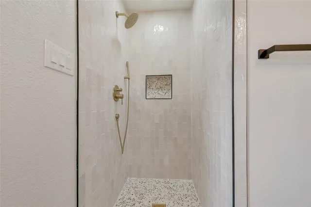 a bathroom with a sink vanity and a mirror