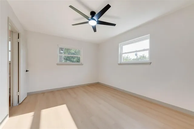 a view of a kitchen with a sink and a refrigerator
