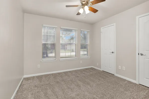 a view of an empty room with a window