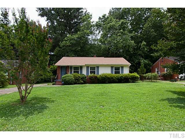 2468 Milburnie Road Raleigh, NC 27610 - Photo 1 of 25 a front view of a house with garden