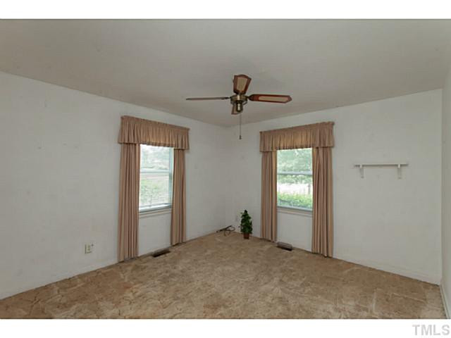 2468 Milburnie Road Raleigh, NC 27610 - Photo 12 of 25 a view of empty room with windows