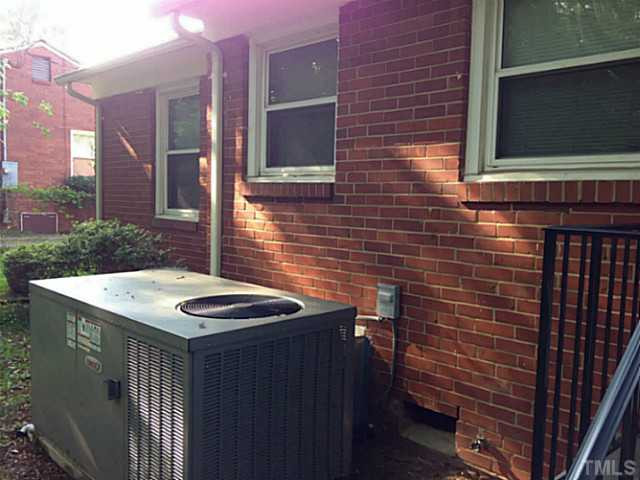 2468 Milburnie Road Raleigh, NC 27610 - Photo 20 of 25 a view of a brick wall of a building