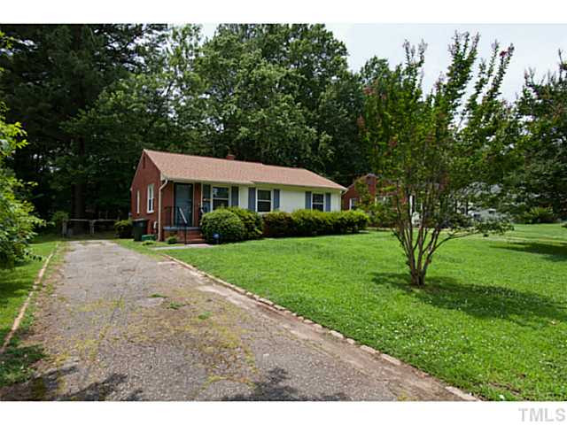 2468 Milburnie Road Raleigh, NC 27610 - Photo 3 of 25 a view of an house with backyard space and garden