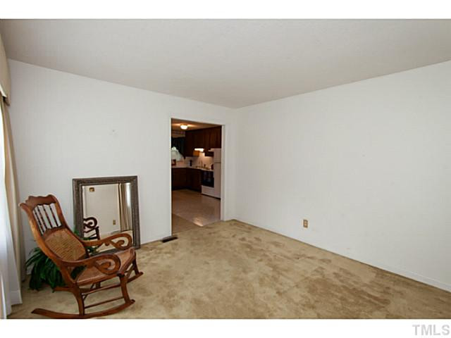 2468 Milburnie Road Raleigh, NC 27610 - Photo 4 of 25 a view of an empty room and chair
