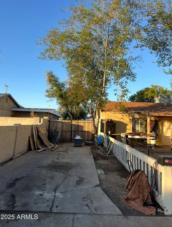 a view of a backyard with a sitting area