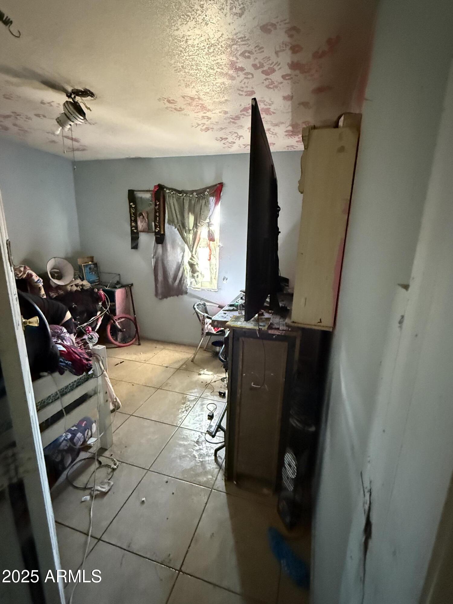 3206 West Pierce Street Phoenix, AZ 85009 - Photo 4 of 12 a view of a room with gym equipment