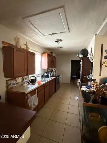 a kitchen with stainless steel appliances kitchen island granite countertop a sink and cabinets