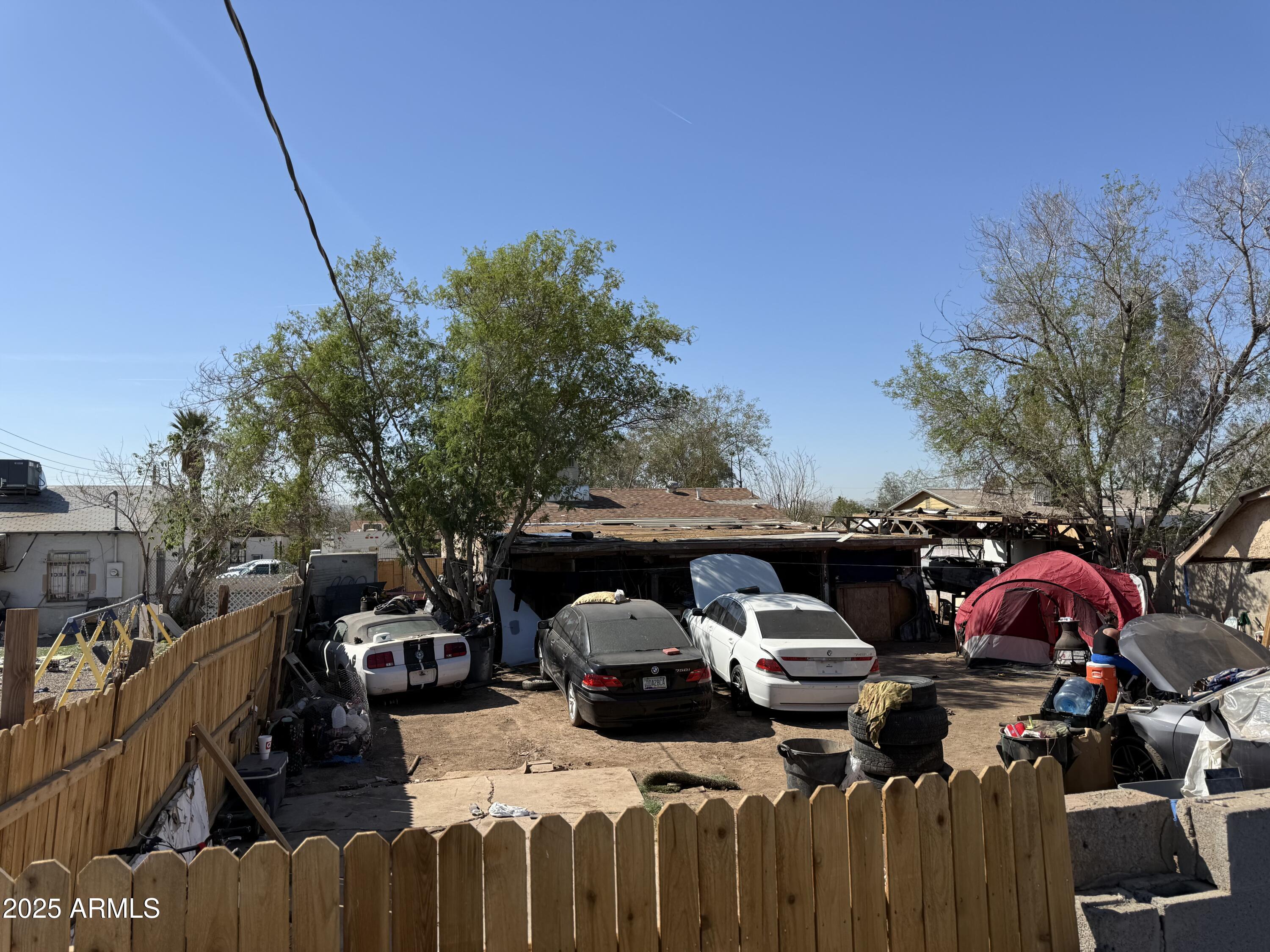 3206 West Pierce Street Phoenix, AZ 85009 - Photo 9 of 12 a view of a street with cars parked