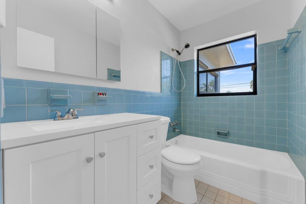 3811 Garfield Street Hollywood, FL 33021 - Photo 11 of 18 a bathroom with a sink toilet and vanity