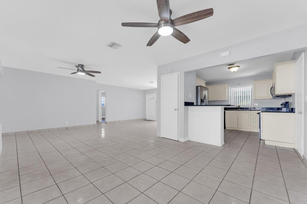 3811 Garfield Street Hollywood, FL 33021 - Photo 13 of 18 a view of a kitchen with microwave and cabinets