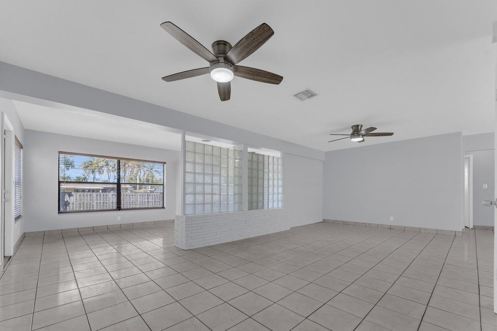 3811 Garfield Street Hollywood, FL 33021 - Photo 14 of 18 an empty room with windows and fan