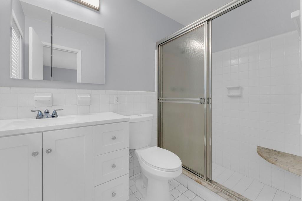 3811 Garfield Street Hollywood, FL 33021 - Photo 6 of 18 a bathroom with a sink a toilet and vanity