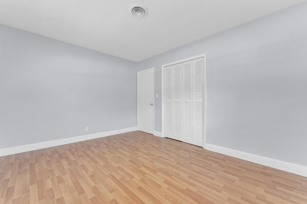 3811 Garfield Street Hollywood, FL 33021 - Photo 8 of 18 a view of an empty room with wooden floor