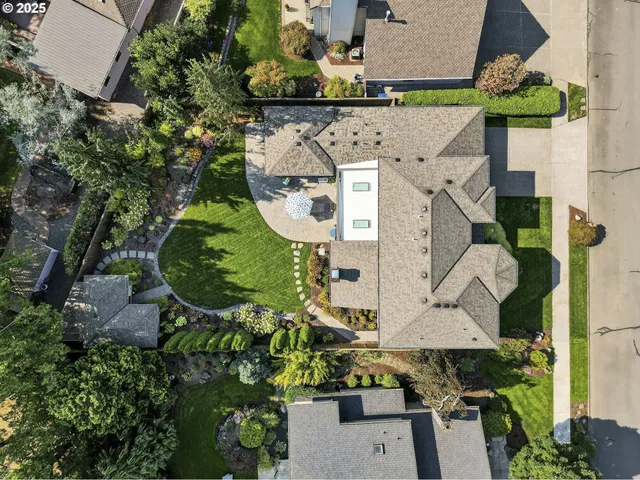an aerial view of a house with outdoor space