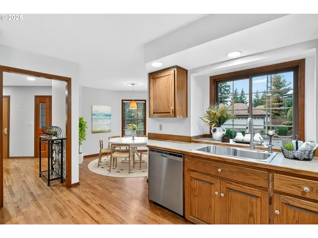 a kitchen with a sink and wooden cabinets