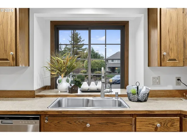 a view of a livingroom with wooden floor and a fireplace
