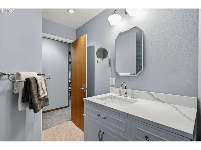 a bathroom with a shower and a sink