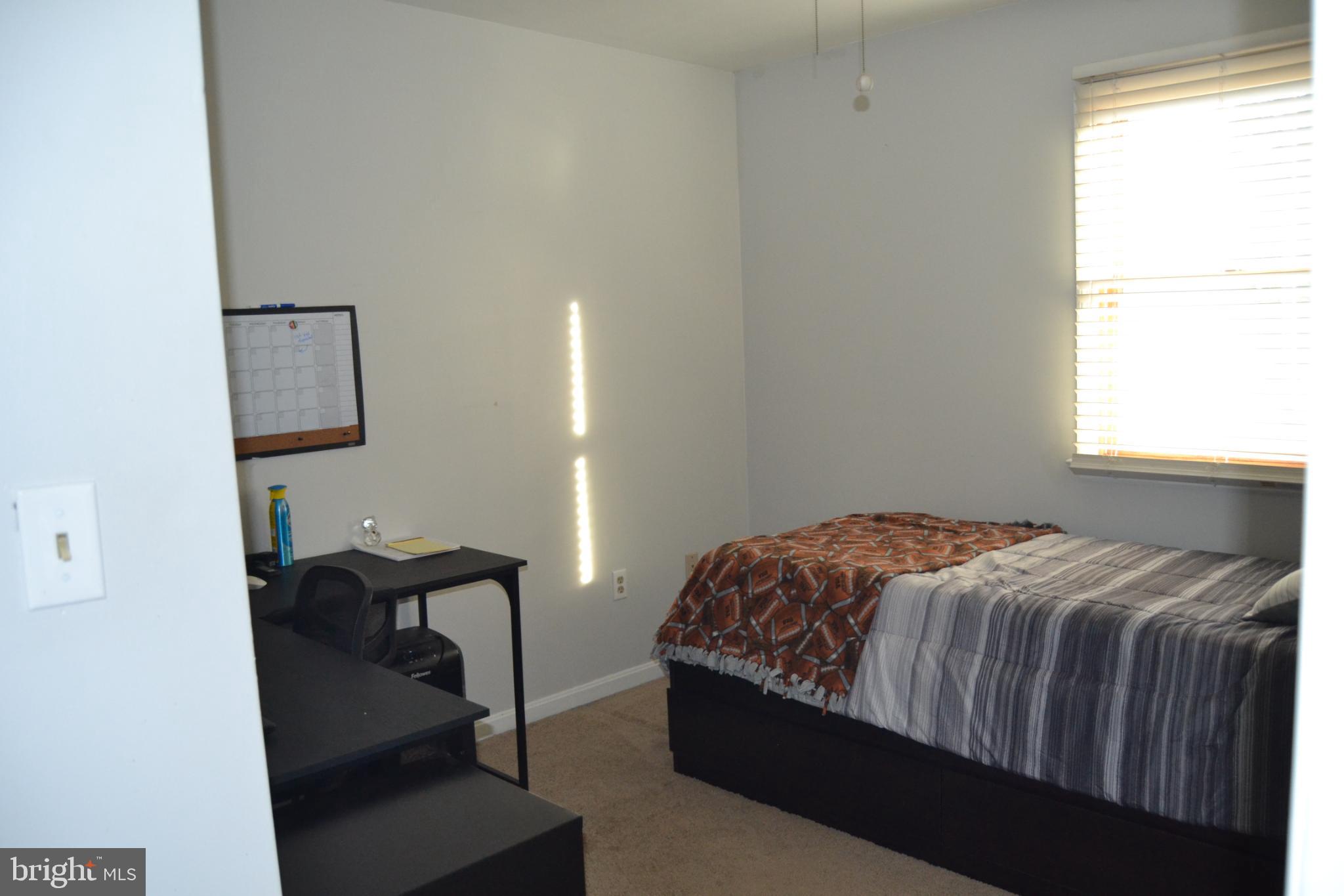 686 State Road West Grove, PA 19390 - Photo 12 of 43 a bed sitting in a bedroom next to a window