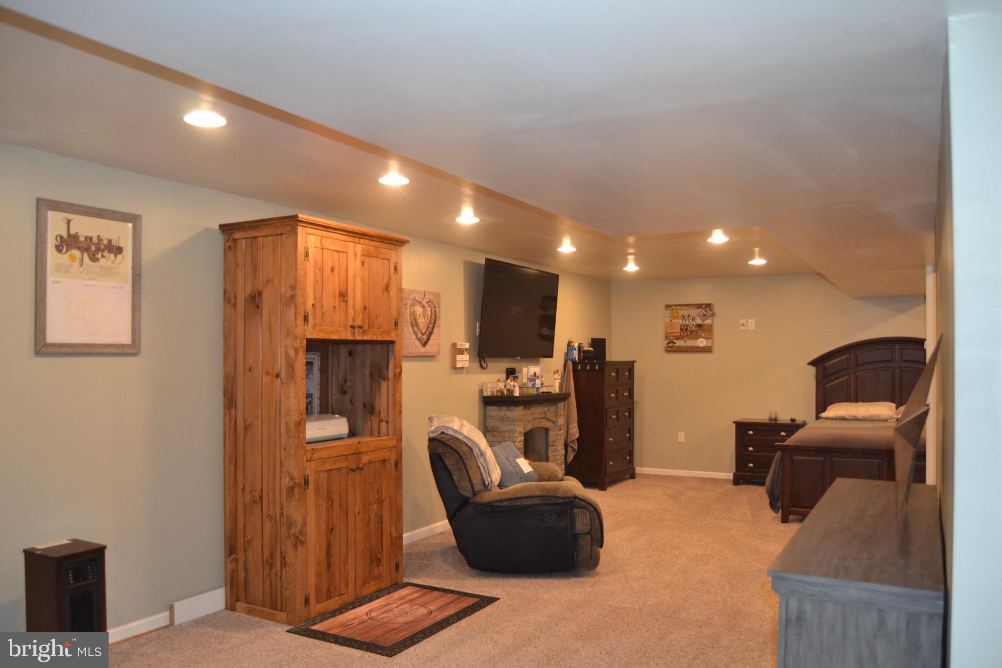 686 State Road West Grove, PA 19390 - Photo 18 of 43 a living room with furniture and a chandelier
