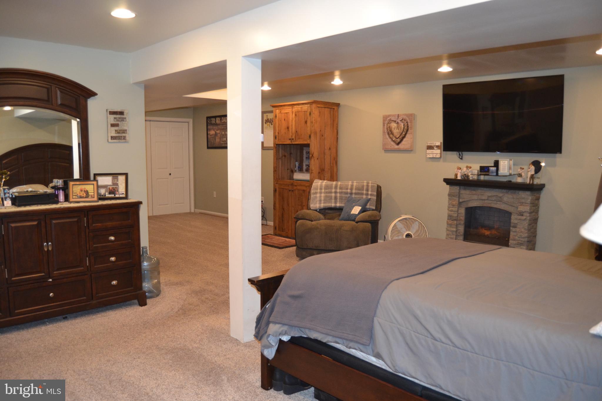 686 State Road West Grove, PA 19390 - Photo 23 of 43 a bedroom with a bed and a flat screen tv