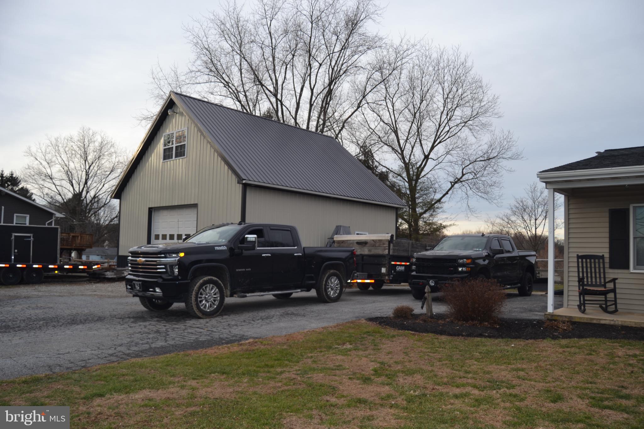 686 State Road West Grove, PA 19390 - Photo 41 of 43 a car parked in front of a house