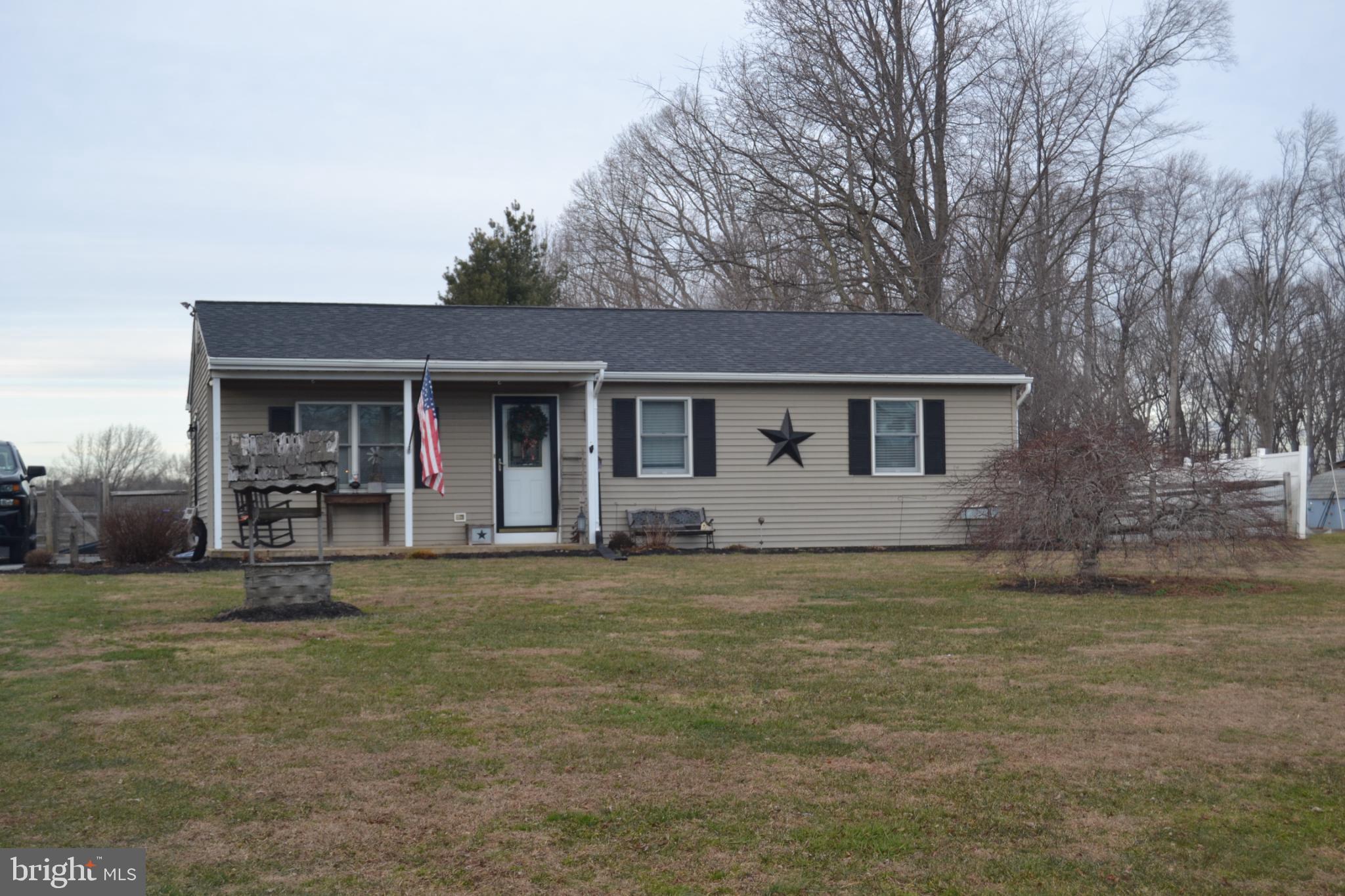 686 State Road West Grove, PA 19390 - Photo 43 of 43 a front view of a house with a garden