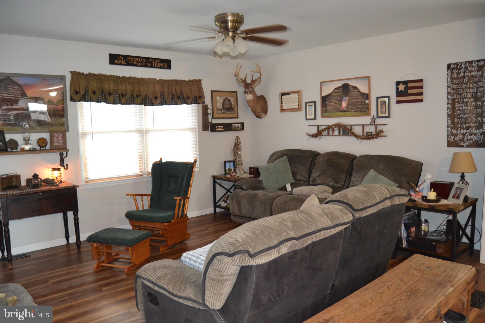 686 State Road West Grove, PA 19390 - Photo 7 of 43 a living room with furniture a table and a large window