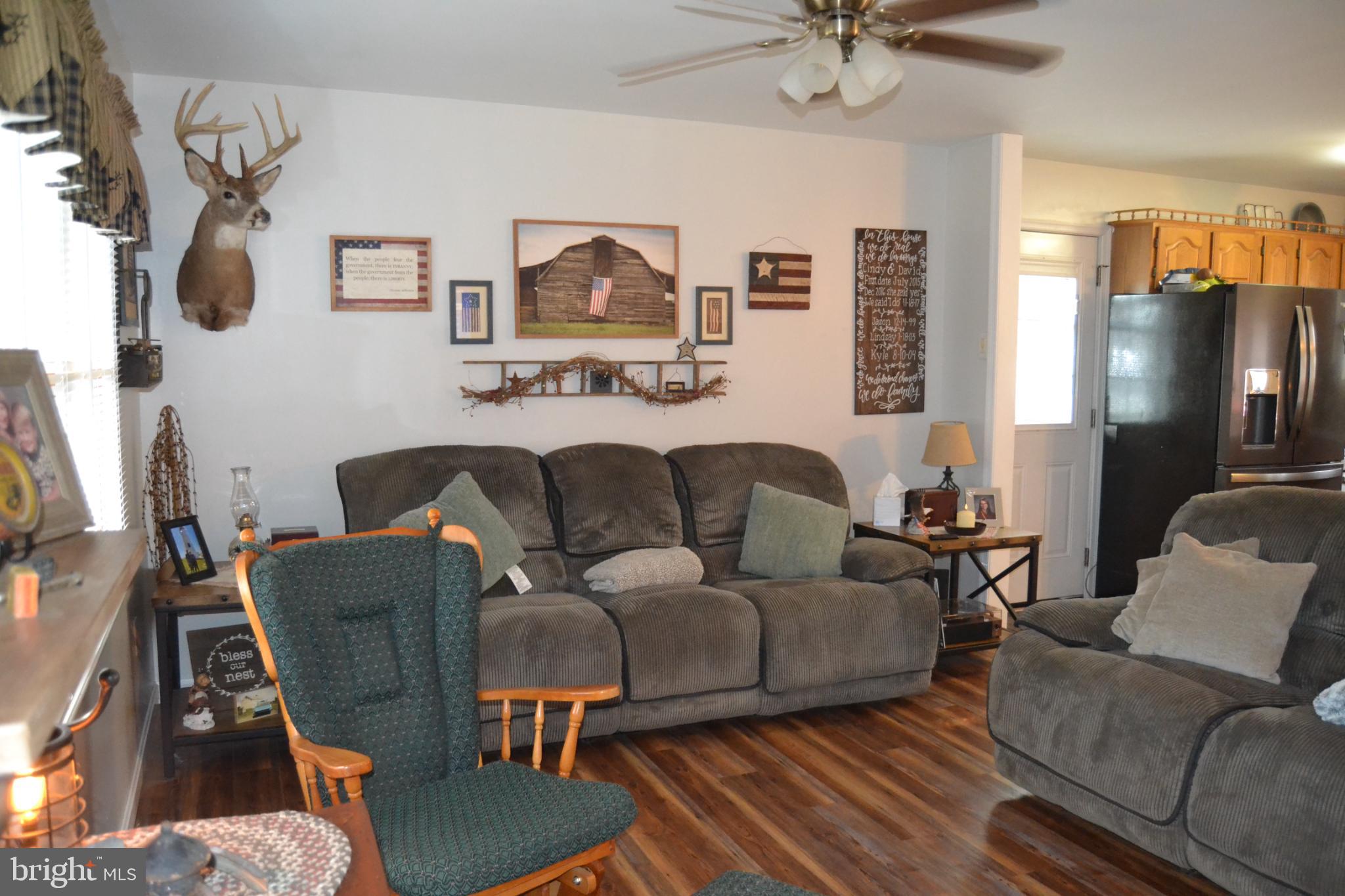 686 State Road West Grove, PA 19390 - Photo 8 of 43 a living room with furniture and a flat screen tv