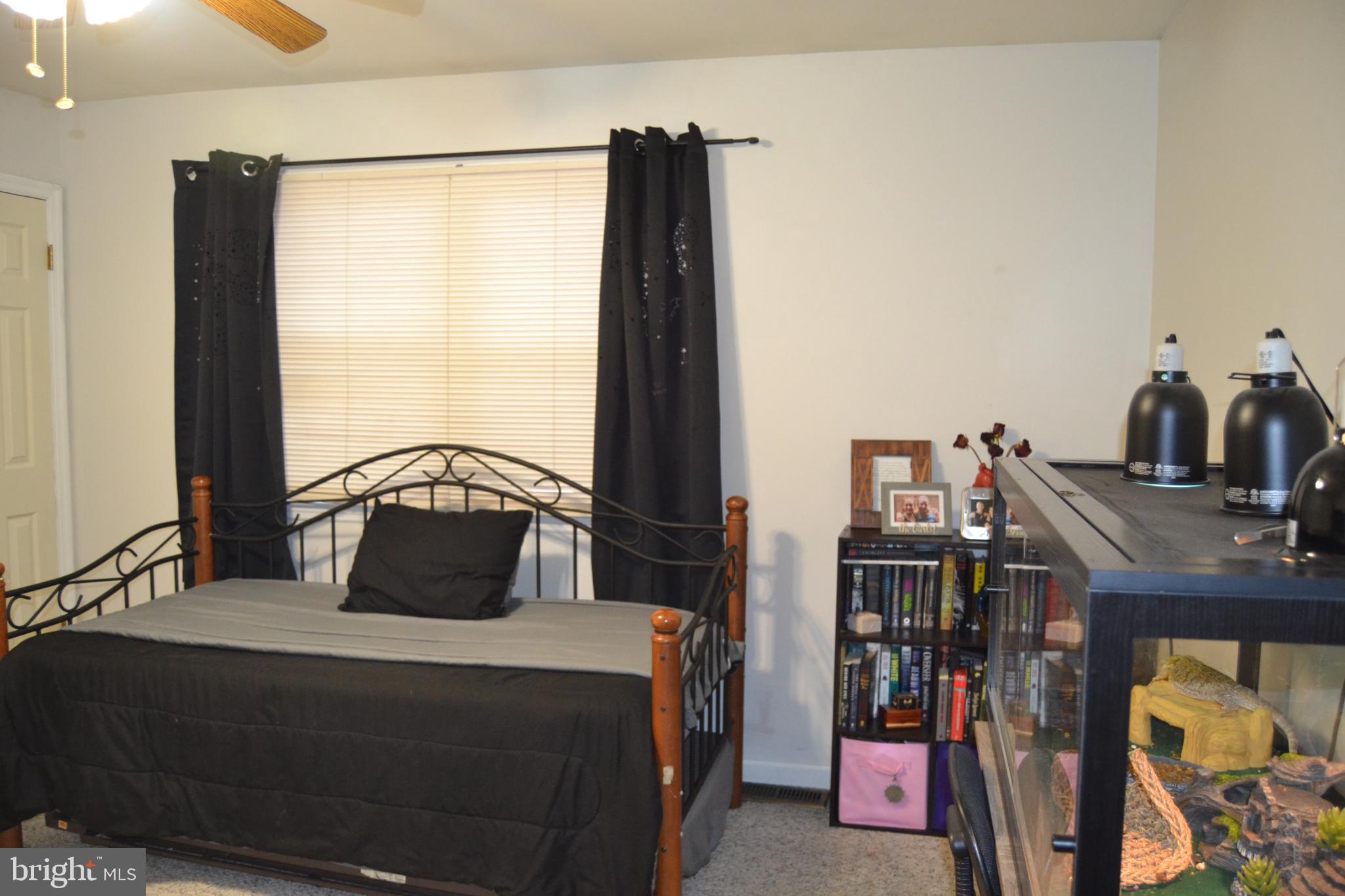 686 State Road West Grove, PA 19390 - Photo 9 of 43 a bedroom with a bed and a window