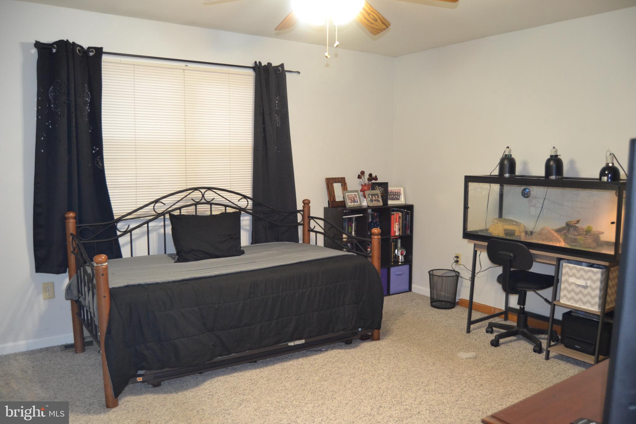 686 State Road West Grove, PA 19390 - Photo 10 of 43 a living room with furniture a flat screen tv and a window