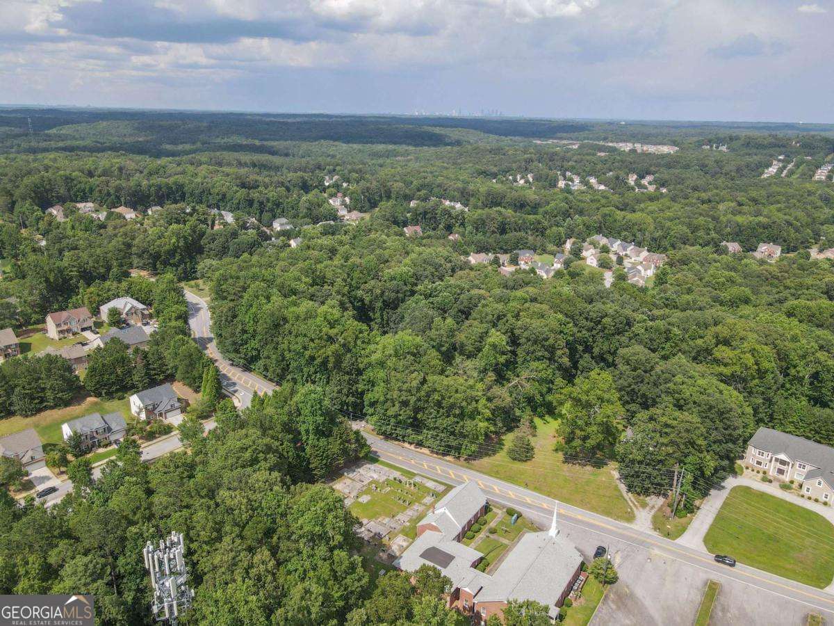 3560 Union Road Southwest Atlanta, GA 30349 - Photo 4 of 7 an aerial view of residential houses with outdoor space and trees