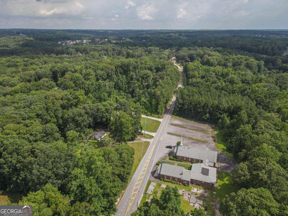 3560 Union Road Southwest Atlanta, GA 30349 - Photo 6 of 7 an aerial view of house with yard and mountain view in back