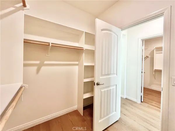 a spacious bathroom with a tub sink shower and a mirror