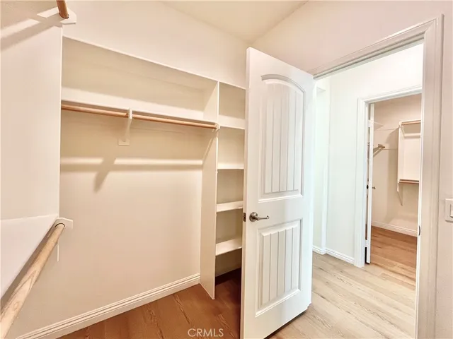 a spacious bathroom with a tub sink shower and a mirror