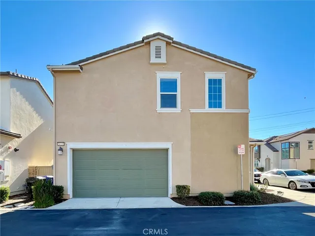 a view of porch with a table and chairs and potted plants