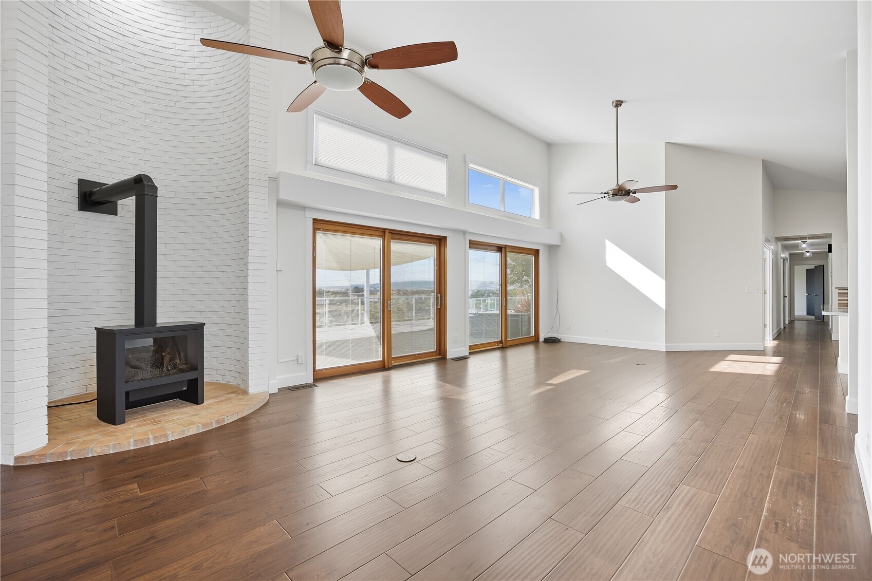 5404 Collins Road West Richland, WA 99353 - Photo 13 of 39 a view of an empty room with wooden floor and a window