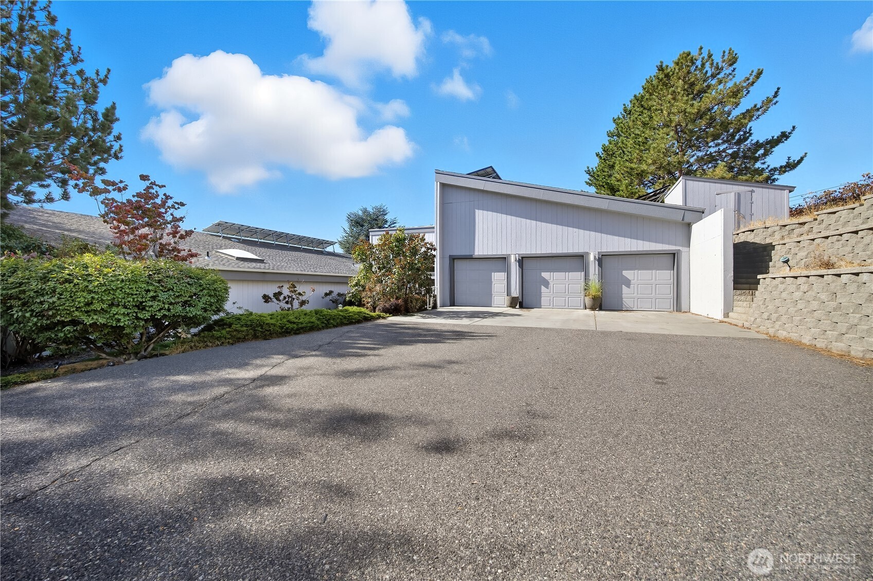 5404 Collins Road West Richland, WA 99353 - Photo 36 of 39 a front view of a house with a yard and garage