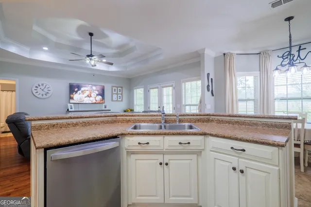 a kitchen with a counter top space and a sink