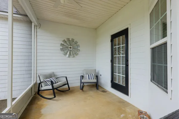 a view of a livingroom with furniture and window