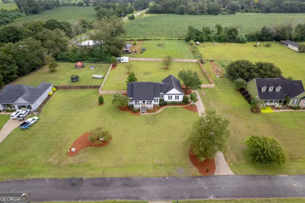 an aerial view of a house with a swimming pool