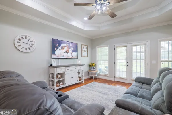 a bedroom with furniture and windows